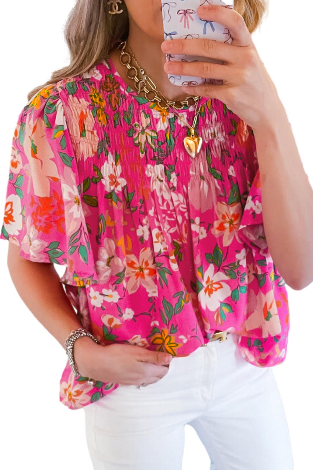 Close-up of the model accessorizing the pink floral blouse with a necklace and earrings (text overlay: "Accessorize Your Way").