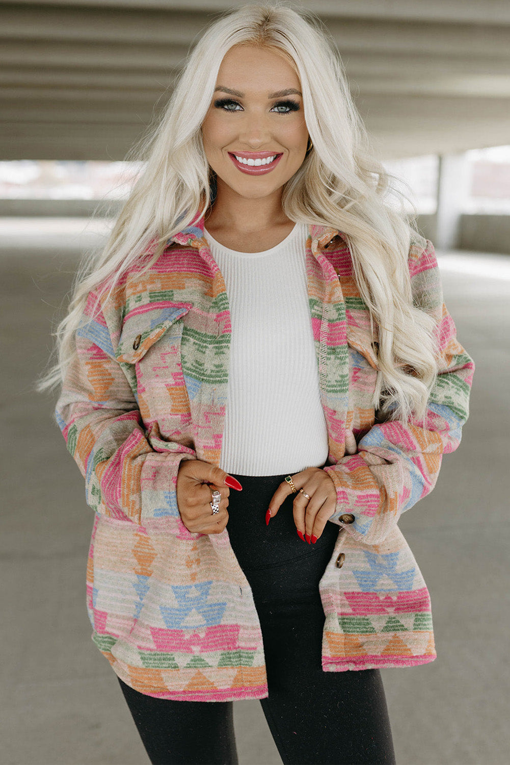 Multicolored geometric jacket hanging on a hanger, showcasing its unique design (text overlay: "Make a Statement").