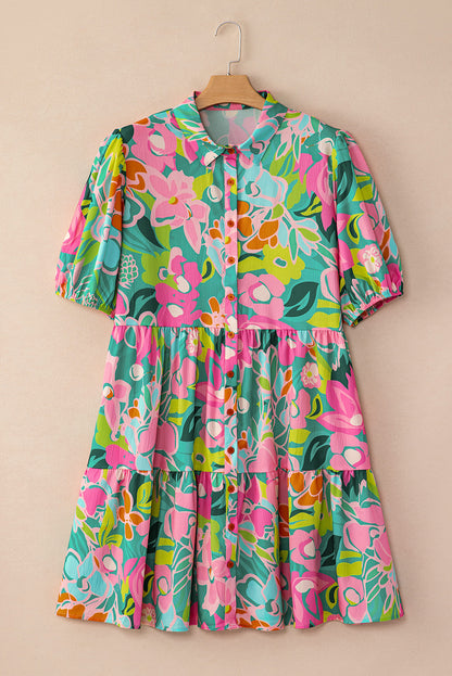 Green floral puff sleeve buttoned babydoll dress hanging neatly on a hanger.