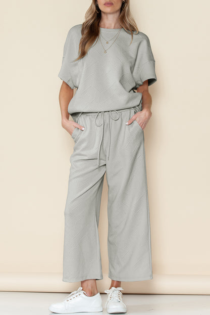 Black textured T-shirt and drawstring pants set: mix and match for endless looks.