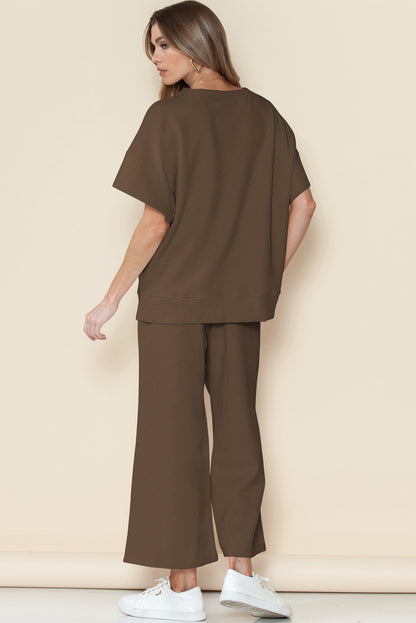 Black textured T-shirt and drawstring pants set: machine washable for easy care