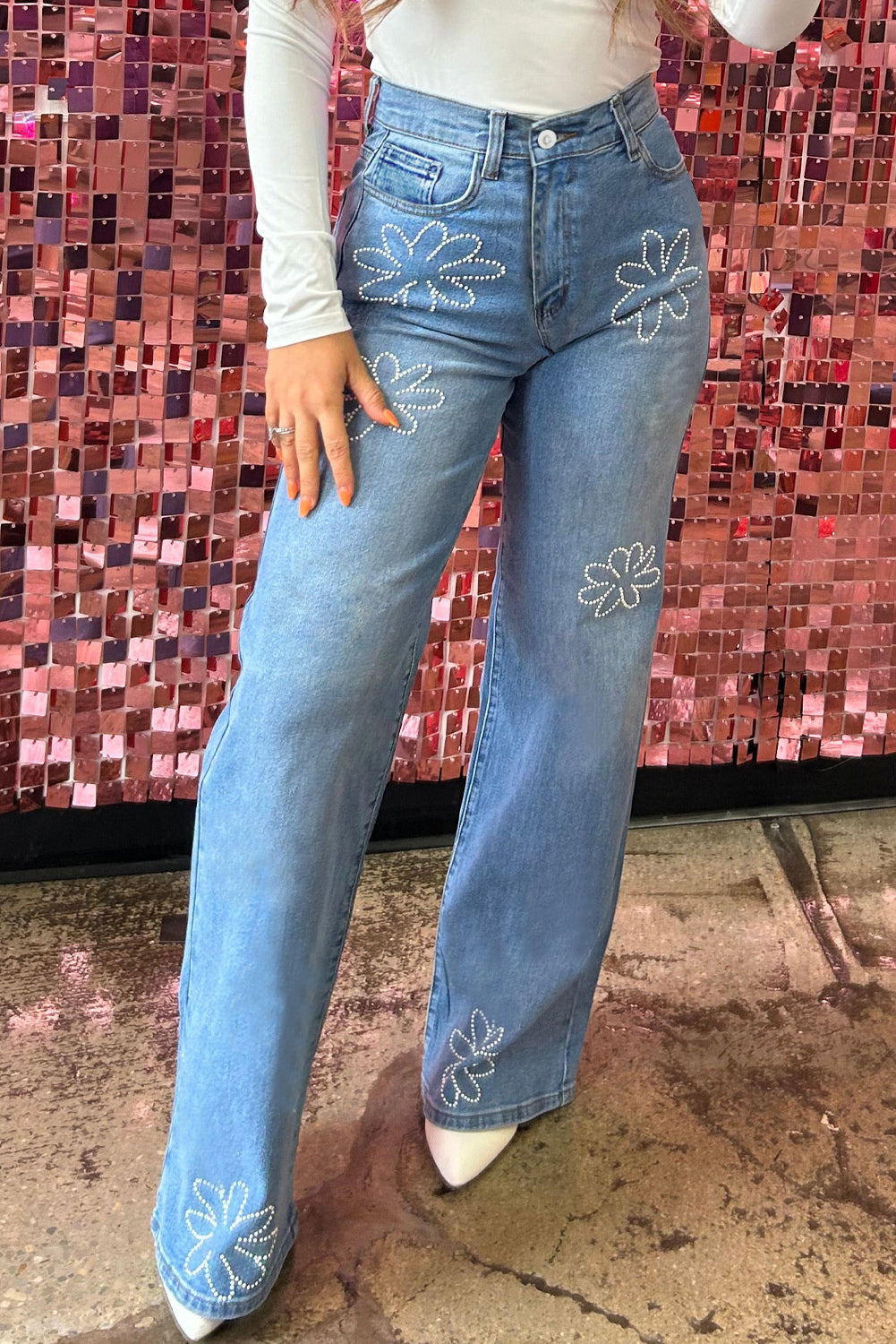 Light blue wide leg jeans with eye-catching floral bead embellishments (women's denim).