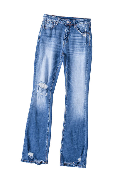 The high waist design of the dark blue ripped raw hem flare jeans creates a flattering silhouette.