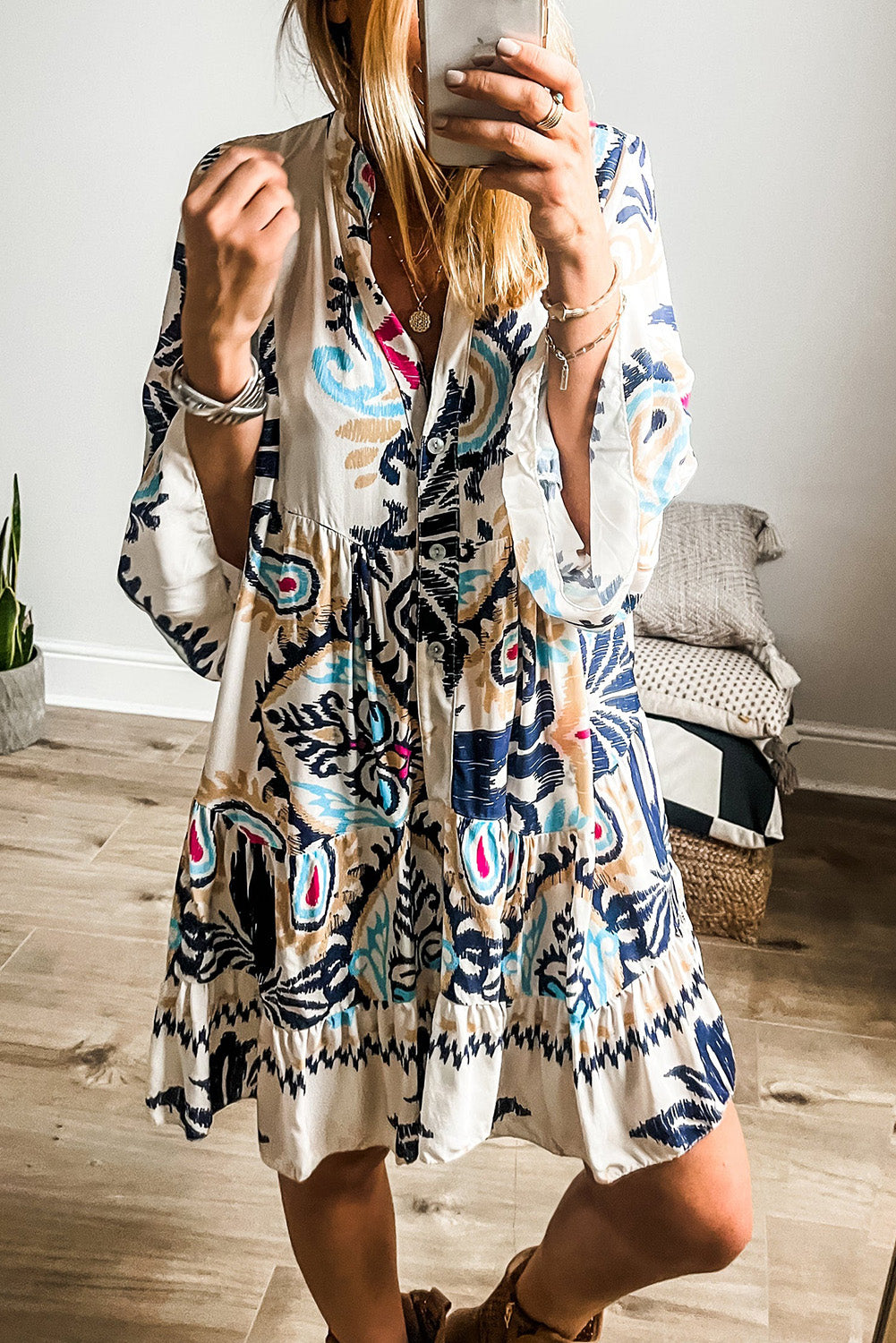 Close-up of the sleeves on the white dress, showing their length and style (e.g., short sleeves with rolled cuffs).