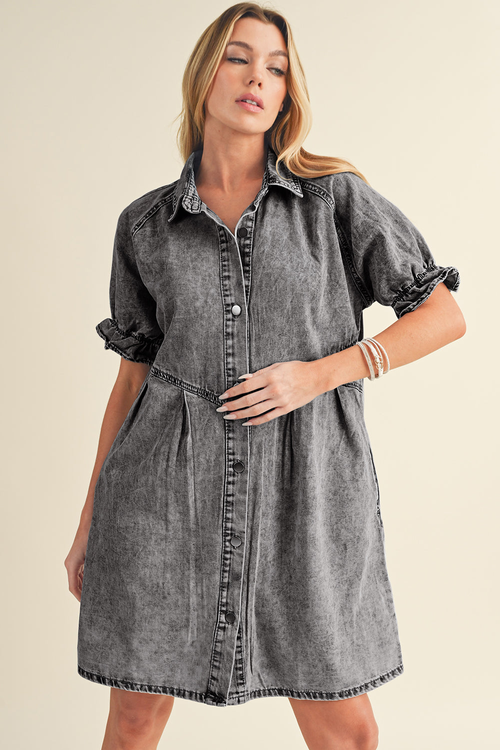 Lounge in comfort and style with the blue mineral washed denim dress with ruffled short sleeves and pockets.