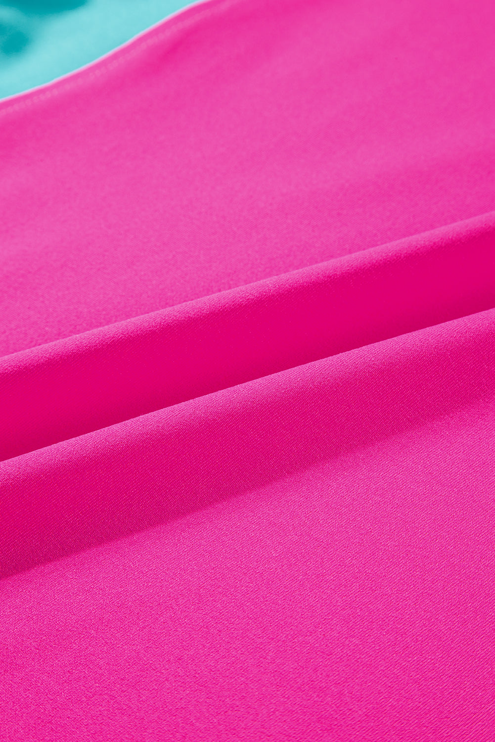 Close-up of the side pockets on the strawberry pink pants, adding functionality.