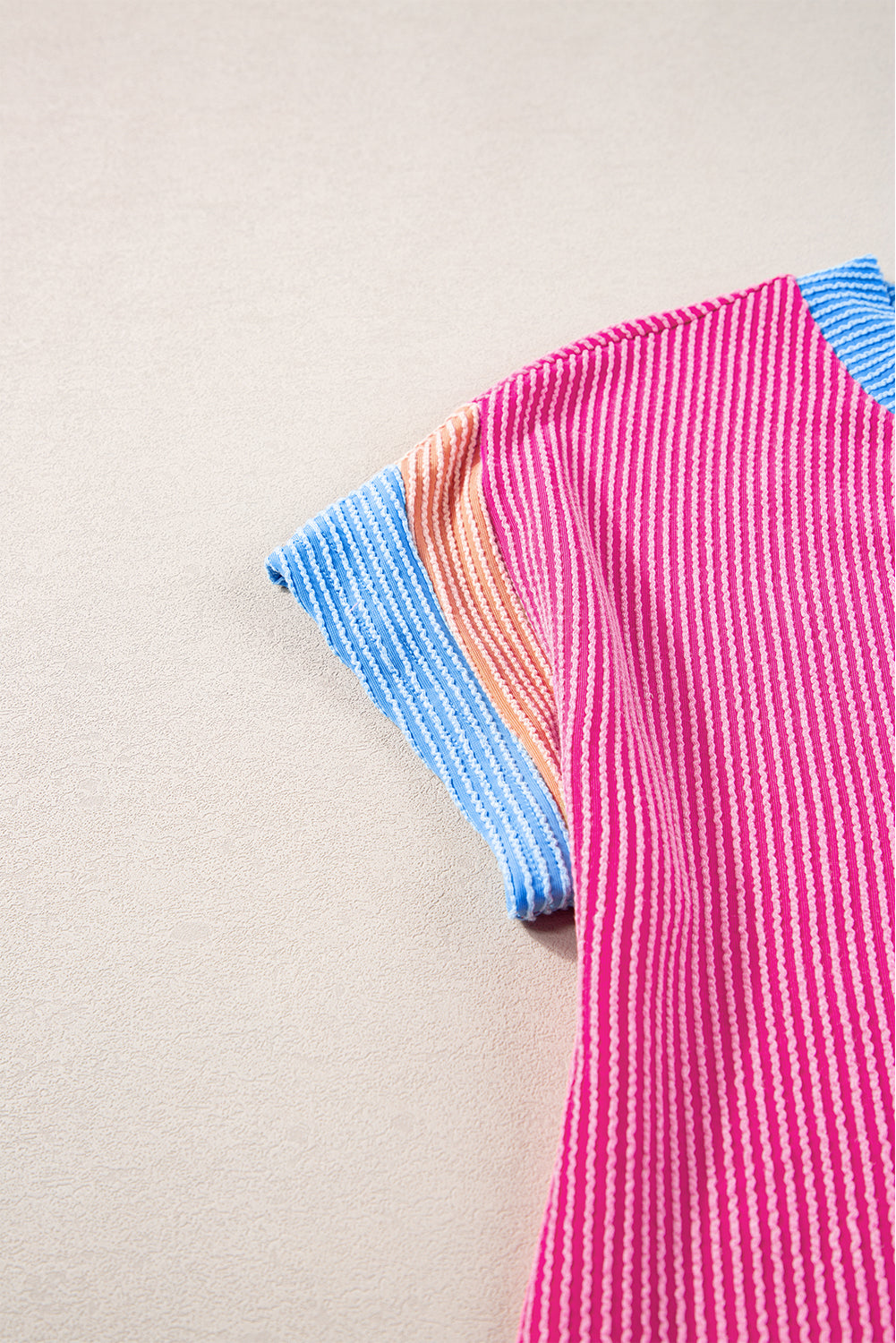 Close-up of the model smiling and looking confident while wearing the rose red t-shirt dress.