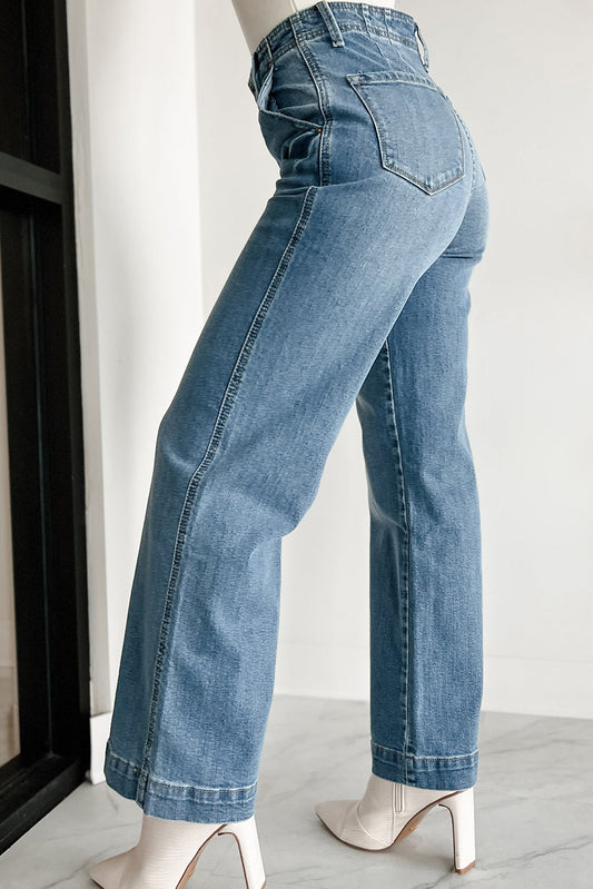 Model wearing dusk blue multi-button waist wash straight leg jeans (front view).