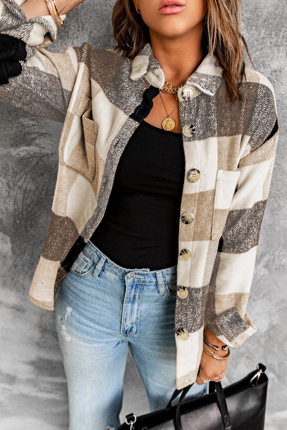 Model wearing a khaki plaid color block buttoned shacket (front view).