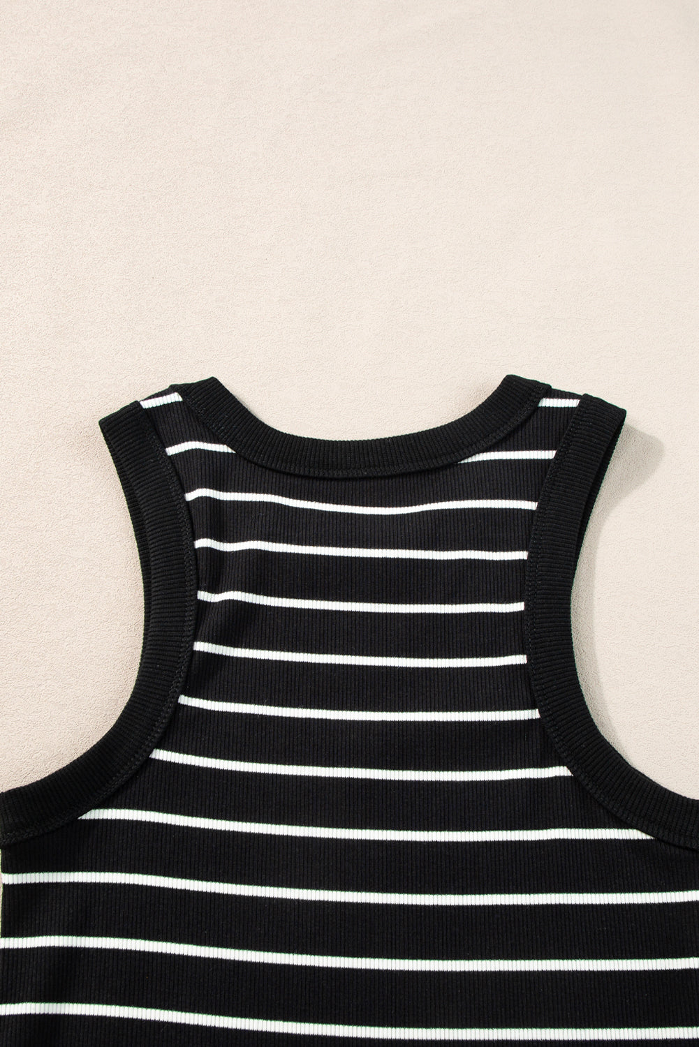 Black and white striped tank mini dress with a comfortable and stretchy fit.