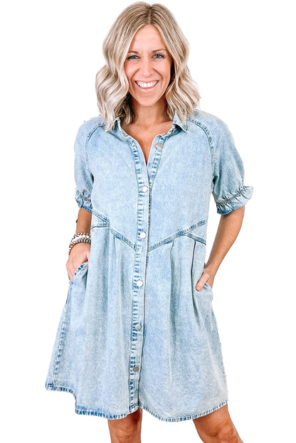 Hemline of the blue mineral washed denim dress (above the knee).