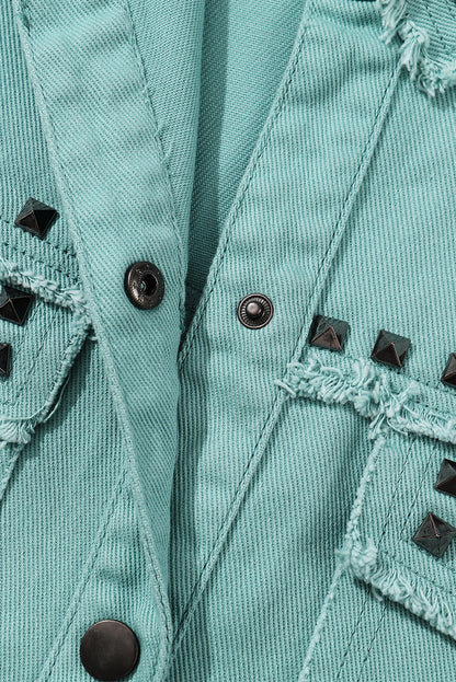 Close-up of any brand label or logo on the green denim jacket.