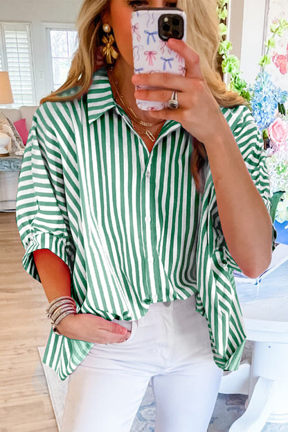 Model sitting and wearing the sky blue striped blouse, showcasing comfort and ease of wear.