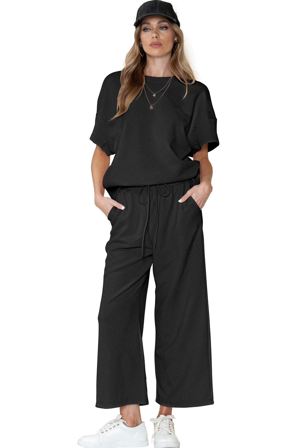 Black textured T-shirt and drawstring pants set in various sizes (size chart available).