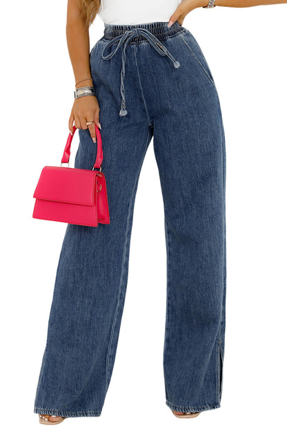 Medium grey drawstring elastic waist wide leg jeans hanging neatly on a hanger.