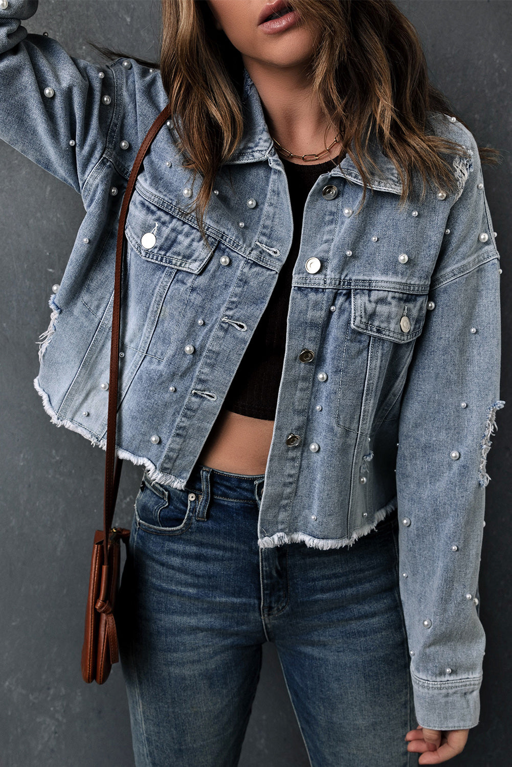 Collage showcasing different ways to style the cropped denim jacket (e.g., with a t-shirt and rolled sleeves, over a skirt).