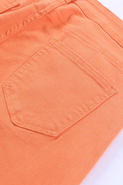 The orange acid wash jeans styled with a tucked-in blouse for a more polished look (text overlay: "Dress It Up").