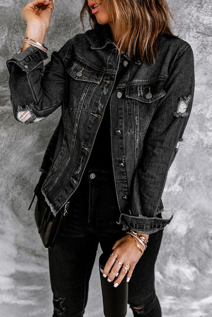 Model wearing black distressed denim jacket (front view).