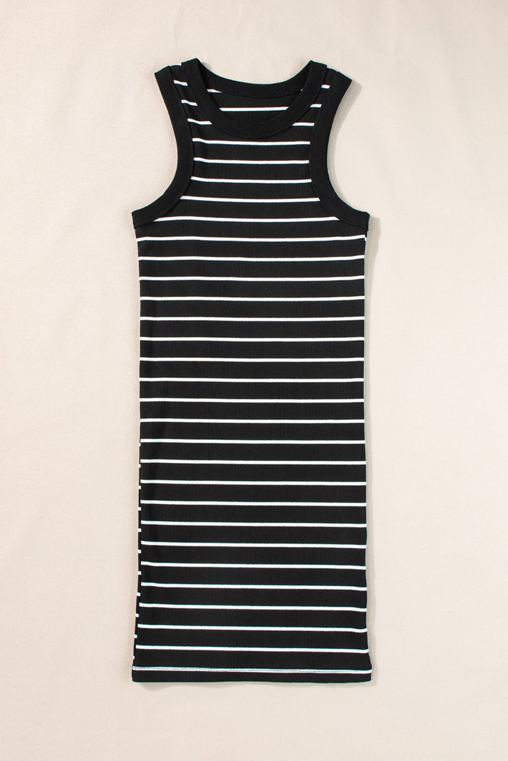 Close-up of the stretchy ribbed knit material on the black and white striped tank mini dress.