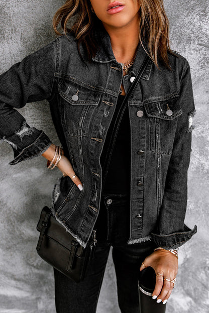 Black denim jacket with distressed details and raw hem.