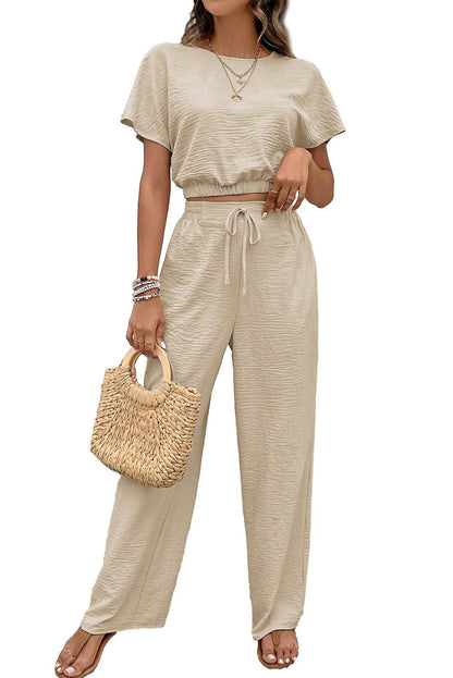 Beige crinkled crop tee and wide-leg pants set size chart, including bust, hem width, length, waist, hip, bottom, inseam, and outseam measurements (available in centimeters and inches)