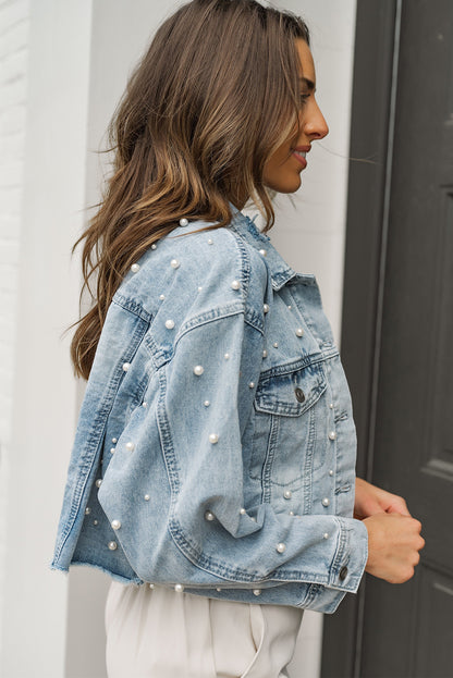 Close-up of the sky blue denim wash on the jacket fabric.