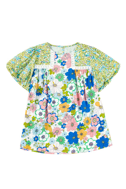 The green color of the blouse is perfect for spring and summer.