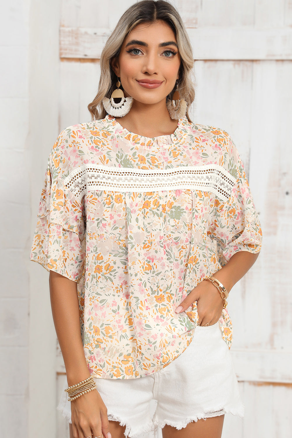 Close-up of the classic round neckline on the multicolor floral blouse.