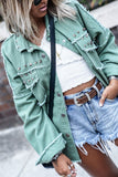 Green denim jacket with frayed trim and vintage rivets (wholesale clothing).