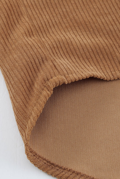 The brown corduroy material is soft and comfortable (close-up).