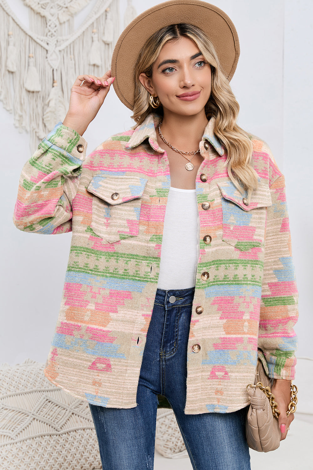 Model wearing a multicolored geometric jacket with a relaxed fit (front view).