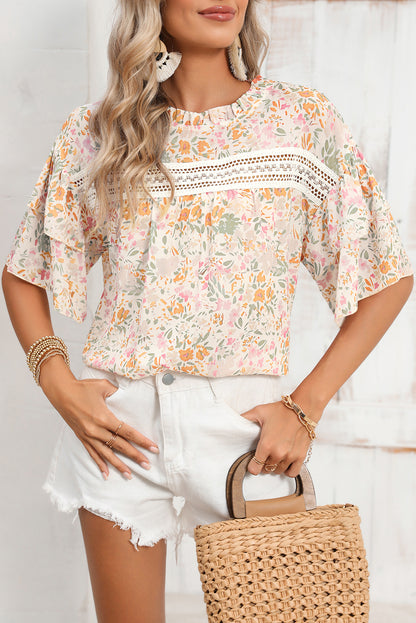 Multicolor floral print blouse with wide batwing sleeves and a round neck (women's top).