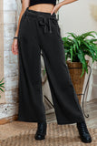 Elevate your summer style! Black high-waisted wide-leg pants.  pen_spark