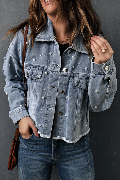 Image featuring multiple sky blue cropped denim jackets on hangers or folded together, highlighting the bulk ordering option. Text overlay: "Wholesale Sky Blue Pearl Denim Jacket (Available in Bulk)".