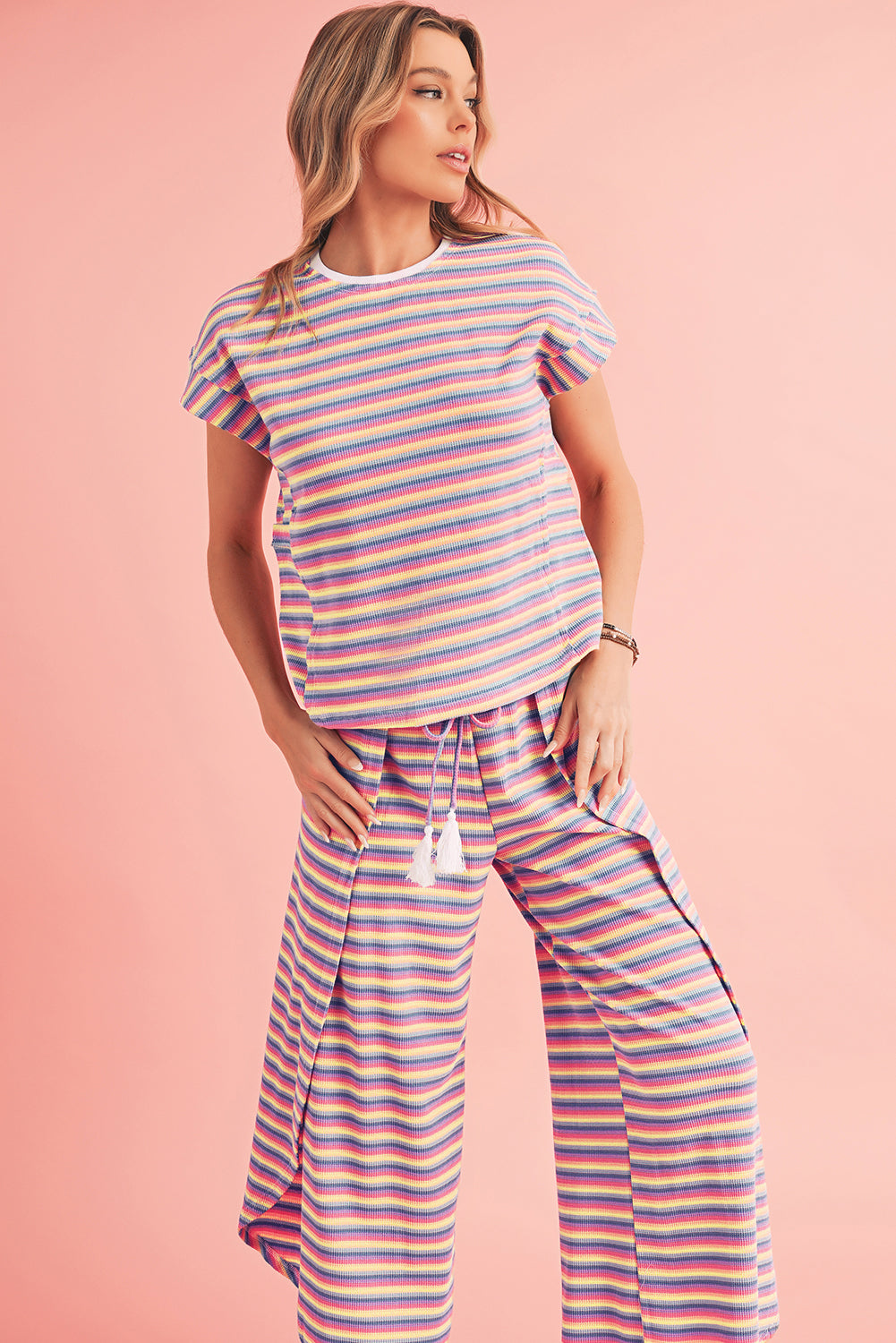 Close-up of the relaxed fit of the pink striped rainbow tee with a casual crew neckline.