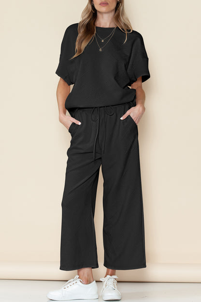 Black textured loose-fit T-shirt and drawstring pants set (comfortable loungewear).