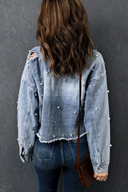 Model wearing the cropped denim jacket with jeans for a casual look.