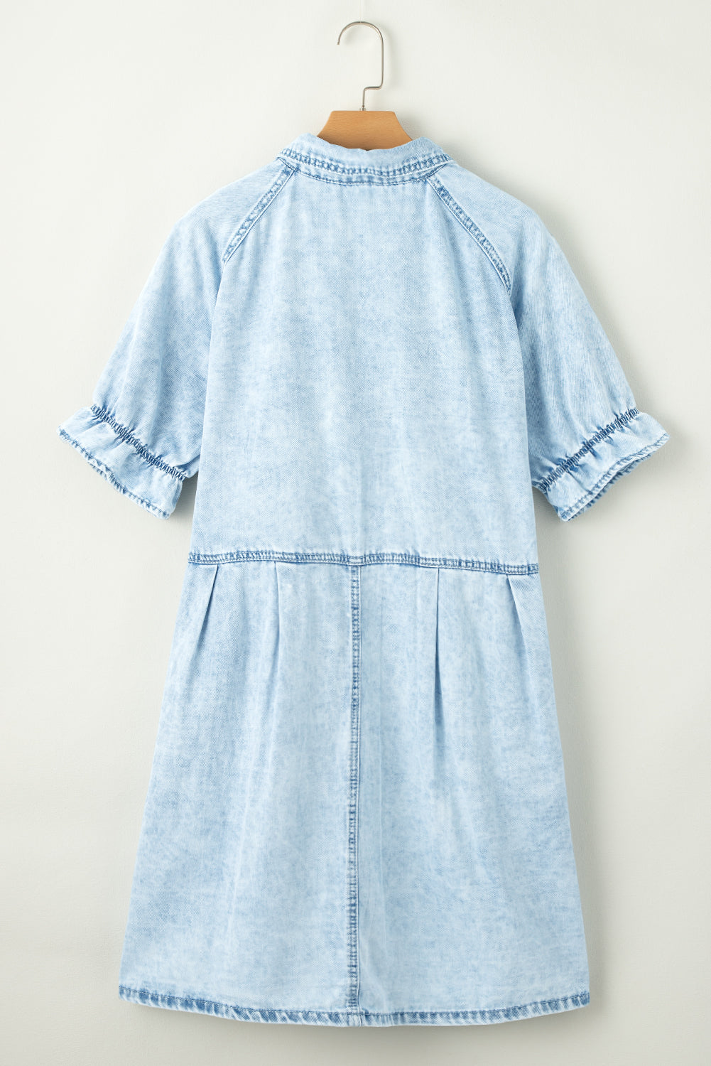 Dress it up with heels for a night out! Blue mineral washed denim dress with ruffled short sleeves and pockets.