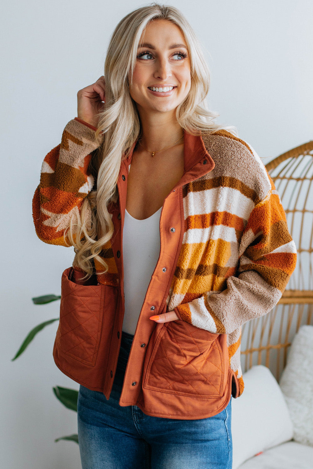 Close-up of the trendy brown striped and geometric design on the fleece jacket.