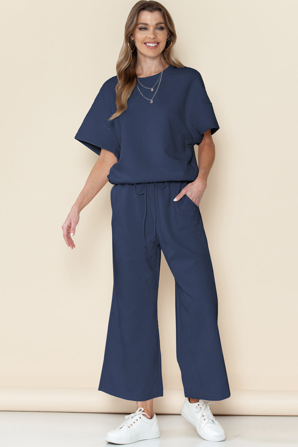 Black textured T-shirt and drawstring pants set: machine washable for easy care