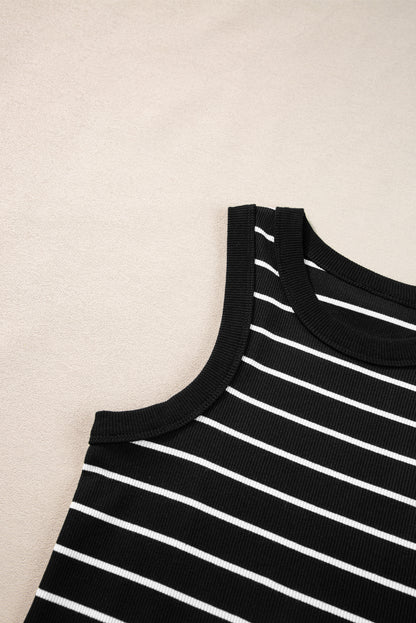 Close-up of the hemline on the black and white striped tank mini dress.