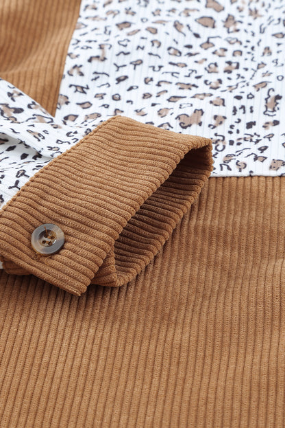 Close-up of the functional pockets on the brown button up colorblock shacket.