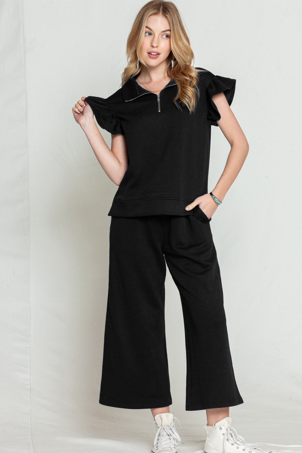 Black textured ruffle cap sleeve top and wide-leg pants set (comfortable and stylish outfit).