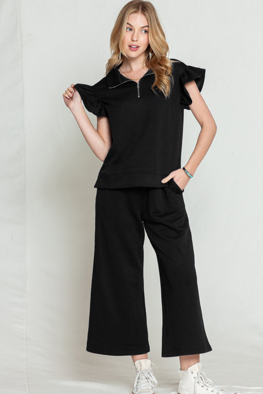 Black textured ruffle cap sleeve top and wide-leg pants set (comfortable and stylish outfit).