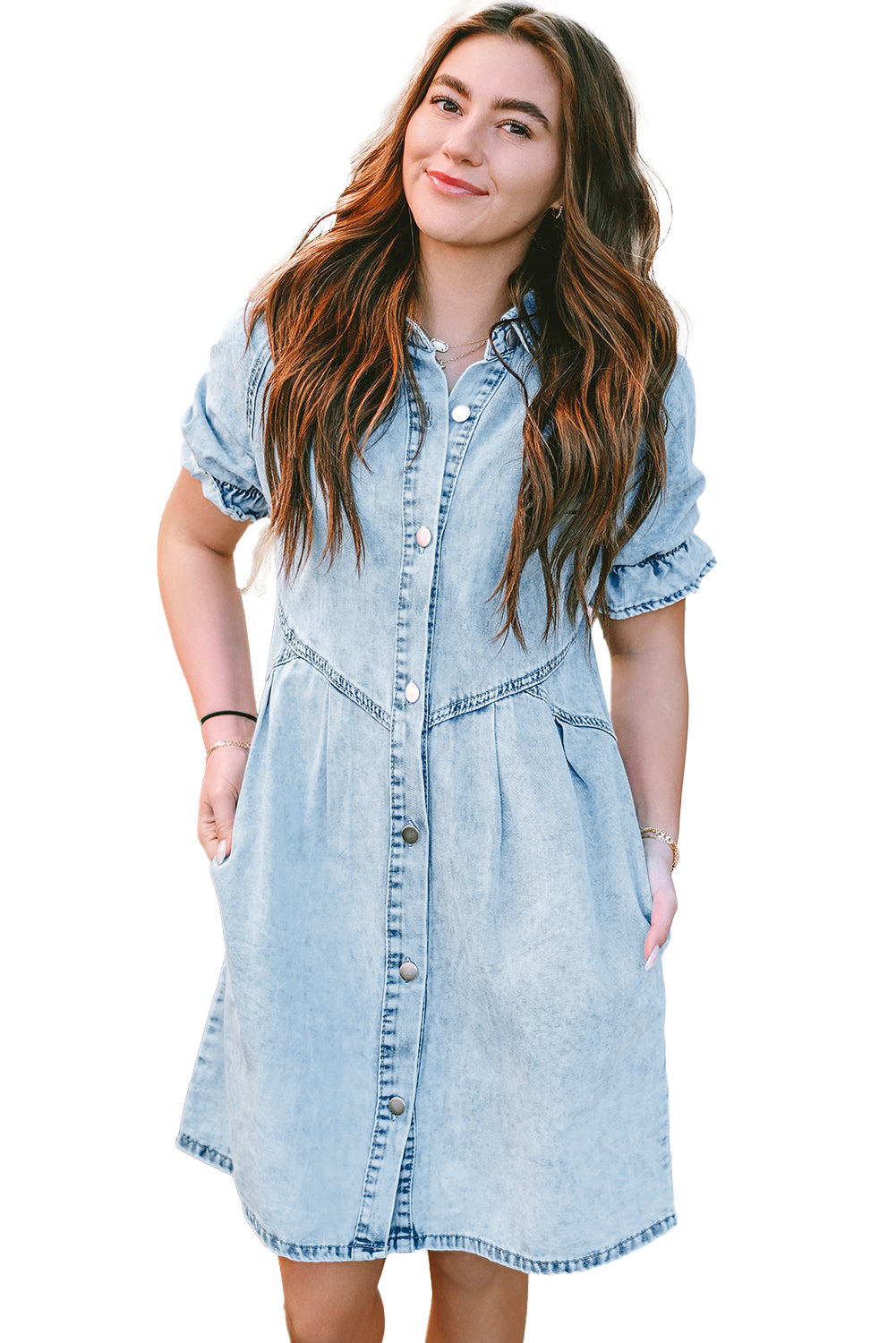 Model wearing the blue mineral washed denim dress with ruffled short sleeves and pockets for a brunch date.