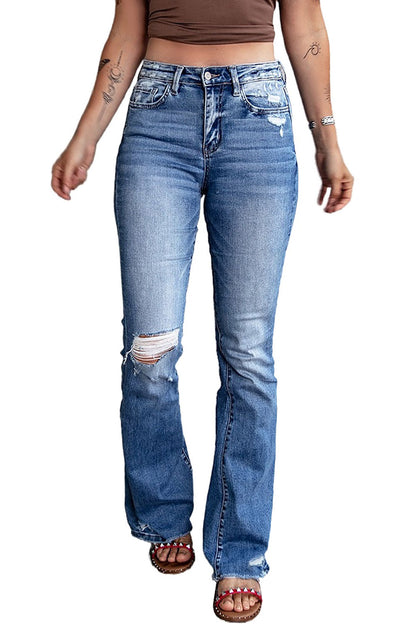 Pair the dark blue ripped raw hem high waist flare jeans with heels for a dressed-up look